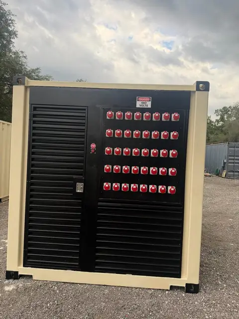 JD Power Packs container with a bank of red reefer receptacles and ventilation louvres.