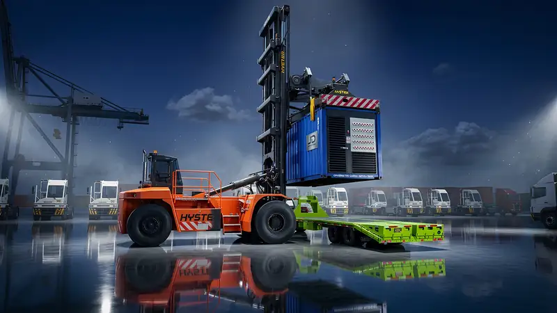 Reach stacker loading a power container onto a trailer at a port terminal.